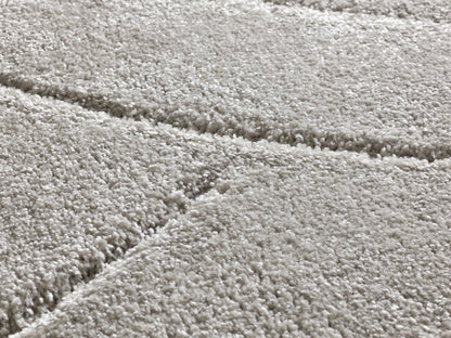 Tappeto a pelo alto disegno in rilievo grigio  - UN3016